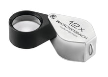 Load image into Gallery viewer, Small circular magnifier encased in black metal, with a silver coloured fold-out case with magnification written on case.
