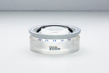 Load image into Gallery viewer, Circular magnifier with twist-to-extend feature retracted and &#39;menas zoom&#39; on base of product.
