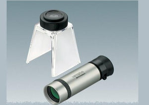 Handheld monocular with silver colour coating and black eyepiece, next to stand with eyepiece for converting monocular to stand magnifier or stand microscope