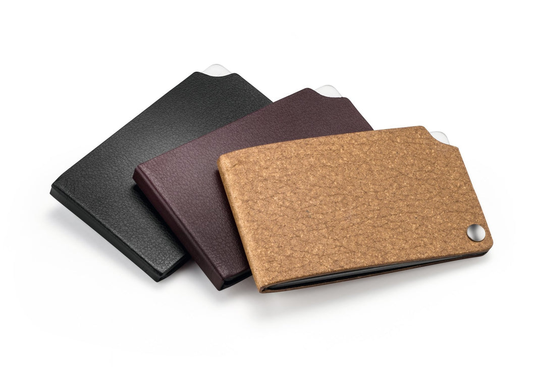 Rectangular compact magnifiers in leather cases in red, brown and black. 