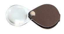Load image into Gallery viewer, Circular magnifier inside clear oval setting, with attached fold-out brown case

